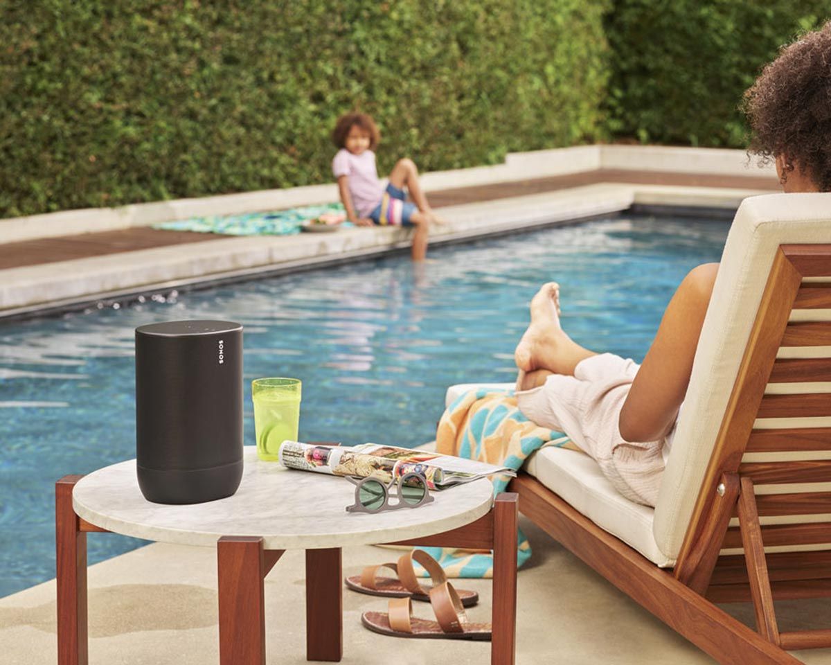 Bluetooth sonos speaker on top of table by a pool